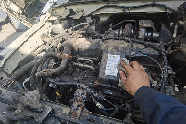 Engine nameplate on Foton truck showing engine model code for turbocharger identification